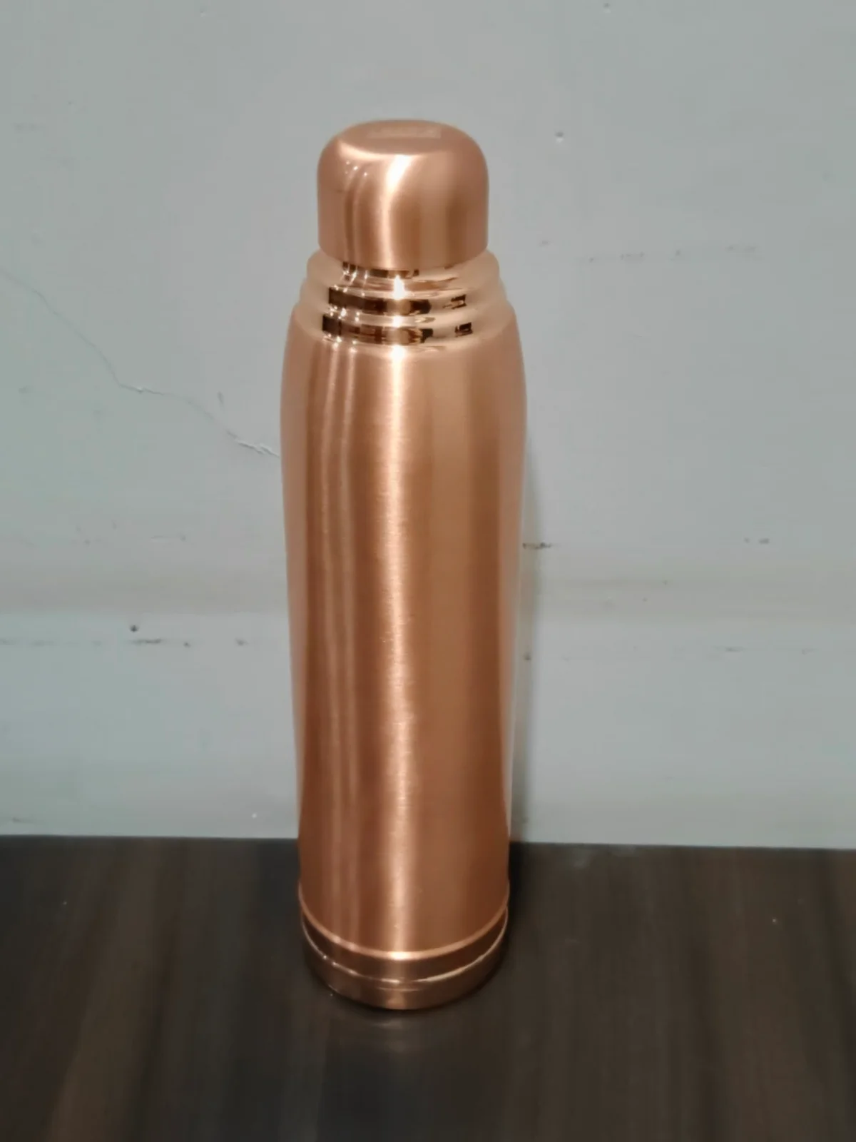VIP pure copper bottle on a modern luxury kitchen countertop